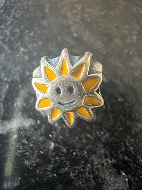 Authentic, retired Pandora "Smiling Sun" charm